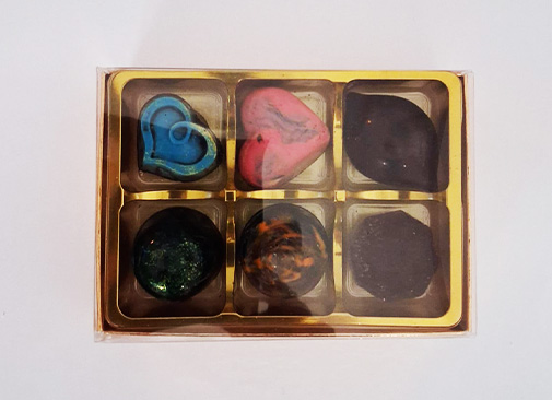 colorful assorted chocolates with text Ajay's treats perfect for dessert lovers and special occasions
